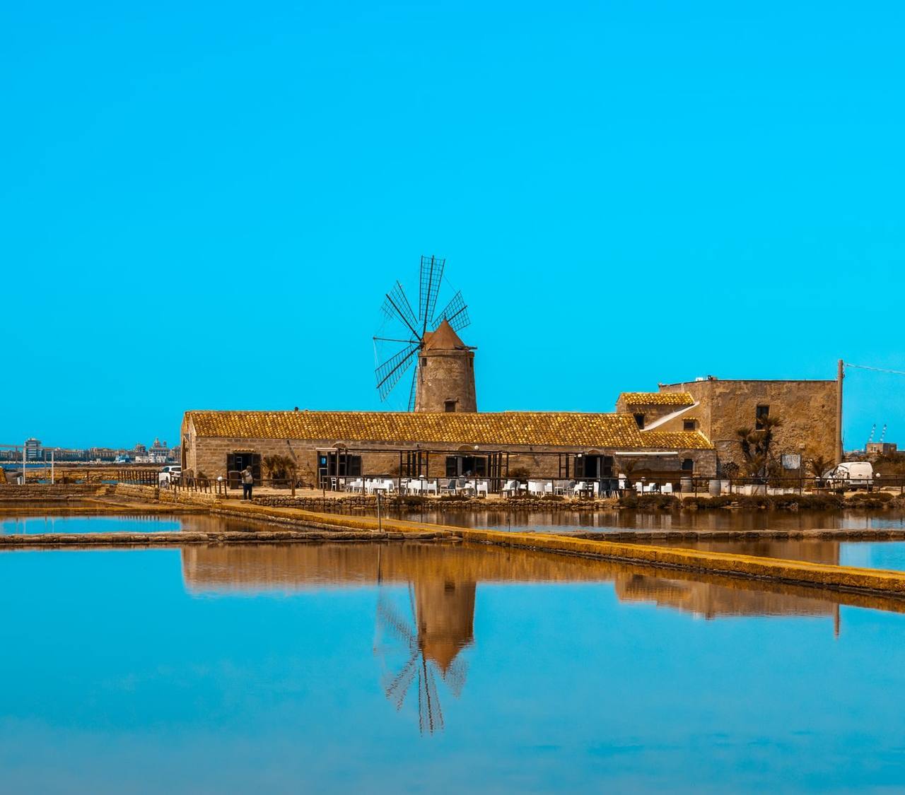 Trapani–Marsala salt-pan windmill (Saline della Laguna), day, solid blue sky