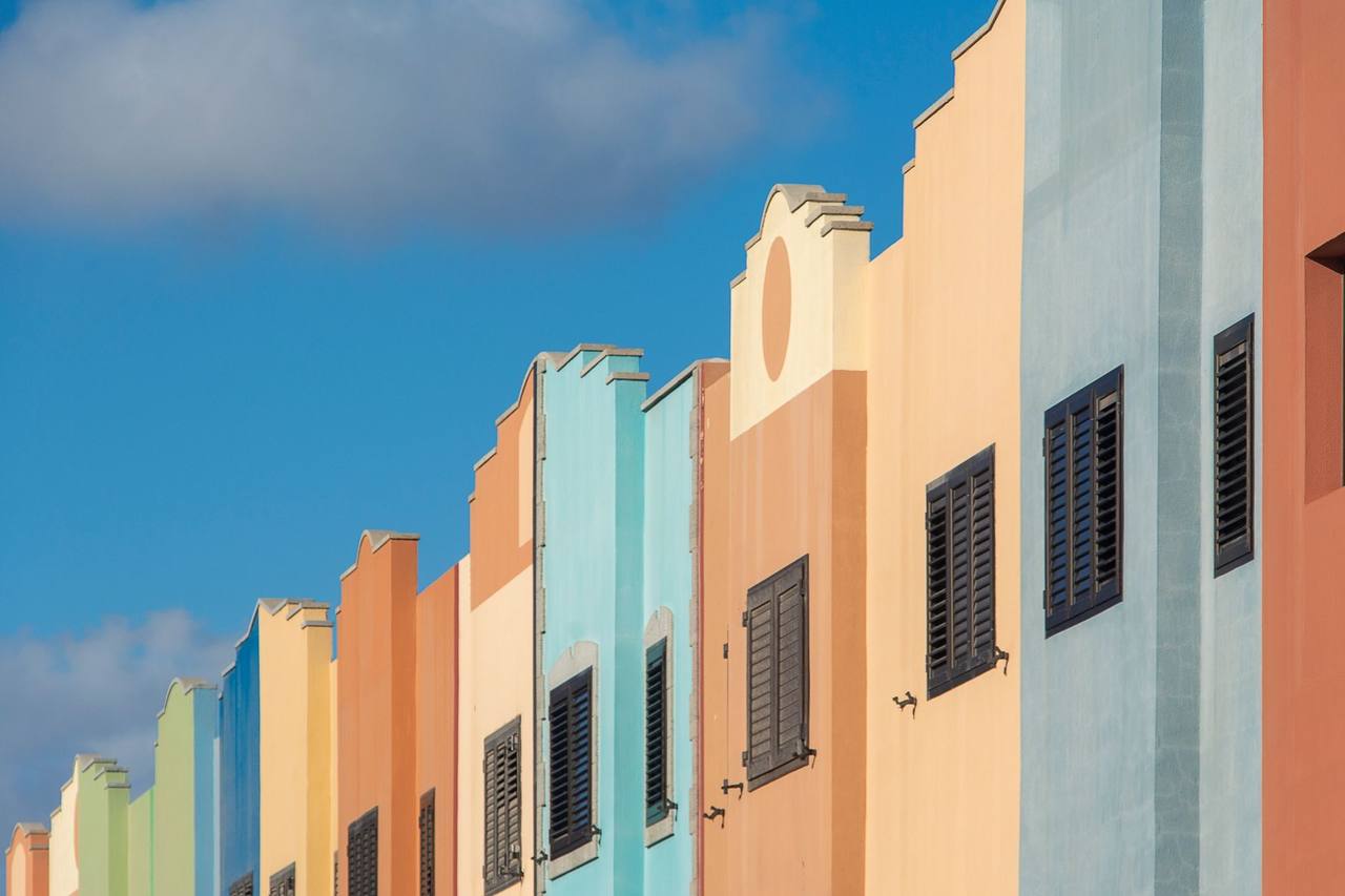 Willemstad Handelskade-style colourful Dutch-Caribbean facades, day, blue sky