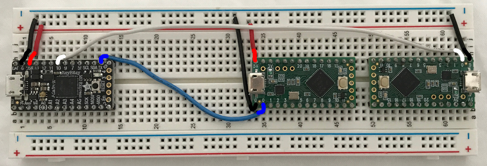 Board with ItsyBitsy M0 and Teensy LCs