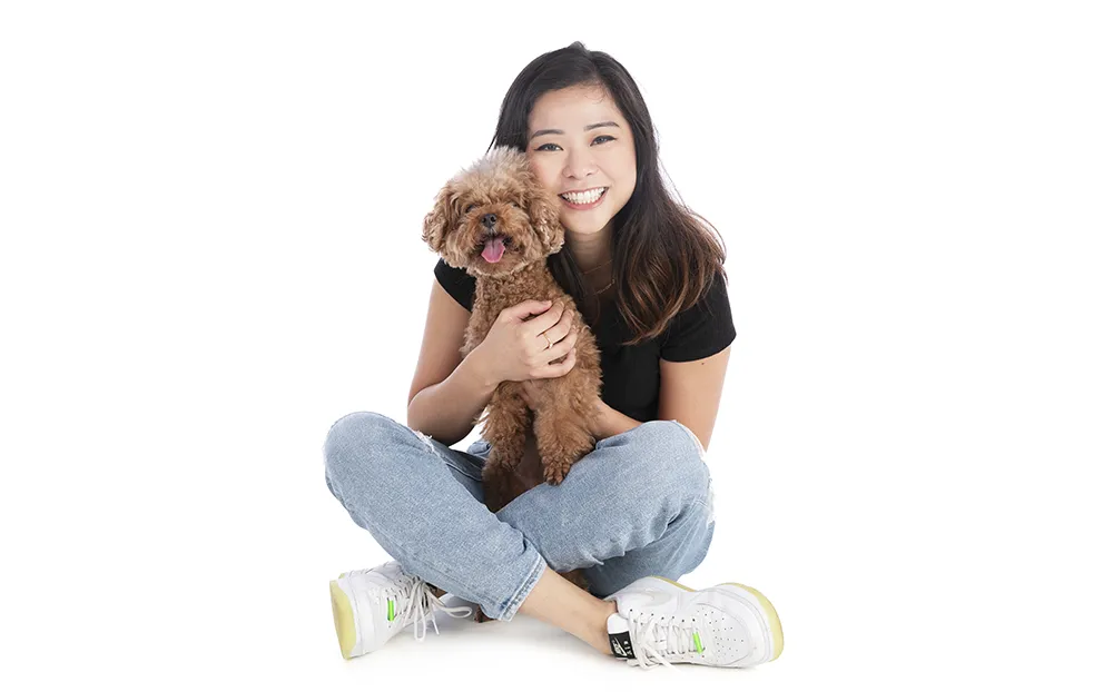 Euge cuddling her dog, Sephy