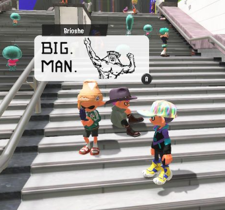 Splatoon 3: a player's drawn post above the plaza stairs reads "BIG. MAN." next to a sketch of a flexing muscleman