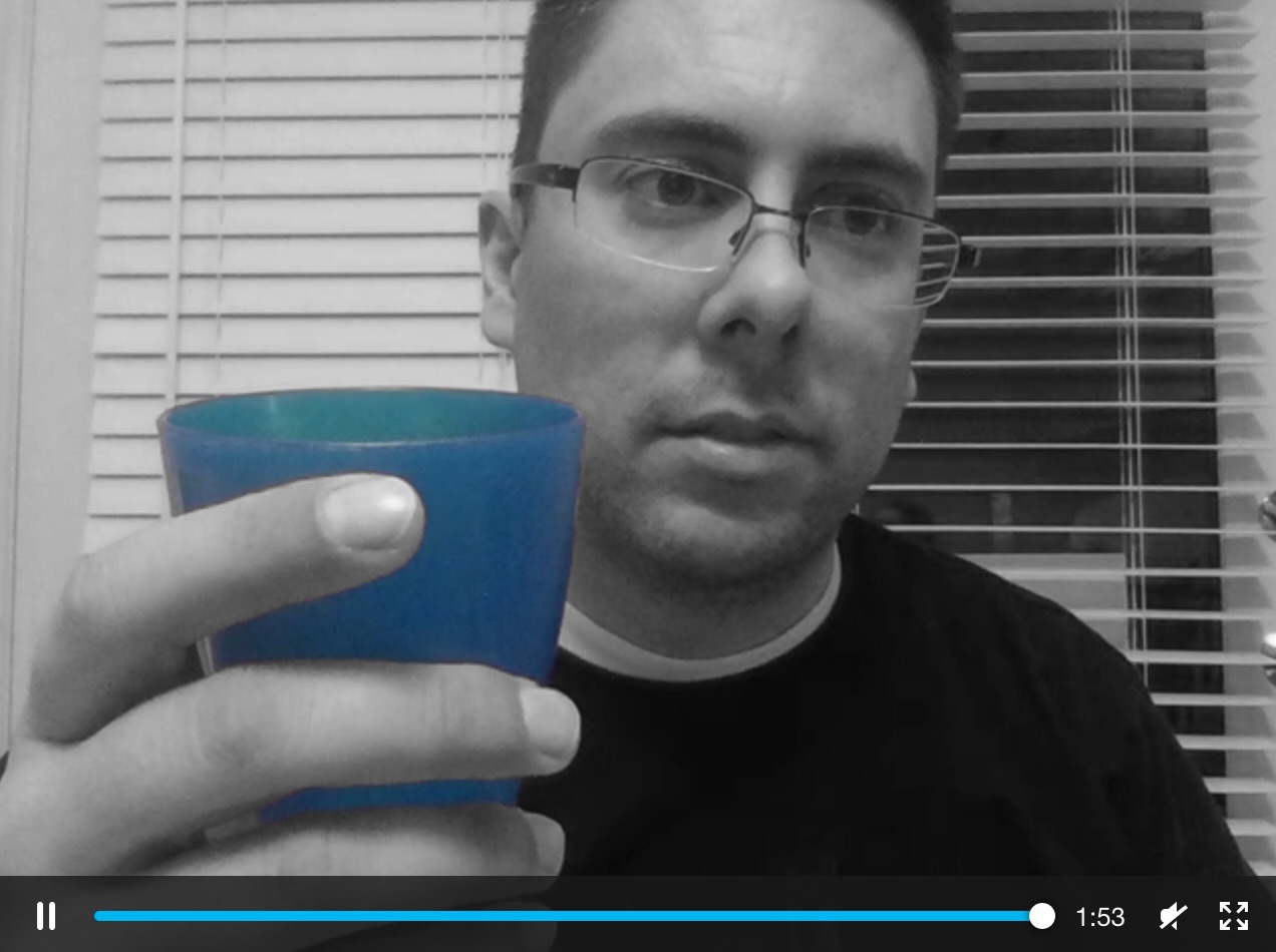 black-and-white video stream with a blue object visible