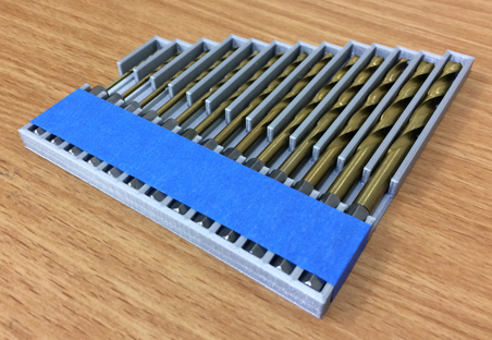 Photo of 3D-printed tray containing drill bits