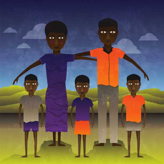 A man, a woman and three boys standing.