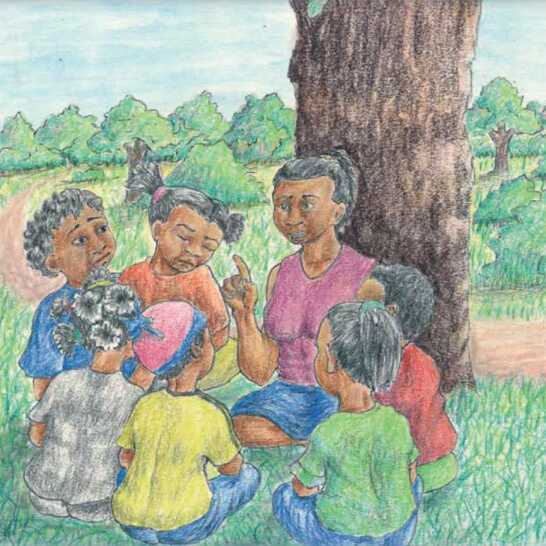 A woman and a group of girls sitting in a circle under a tree.