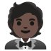 person in tuxedo: dark skin tone emoji on Google