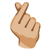 hand with index finger and thumb crossed: medium-light skin tone emoji on Google