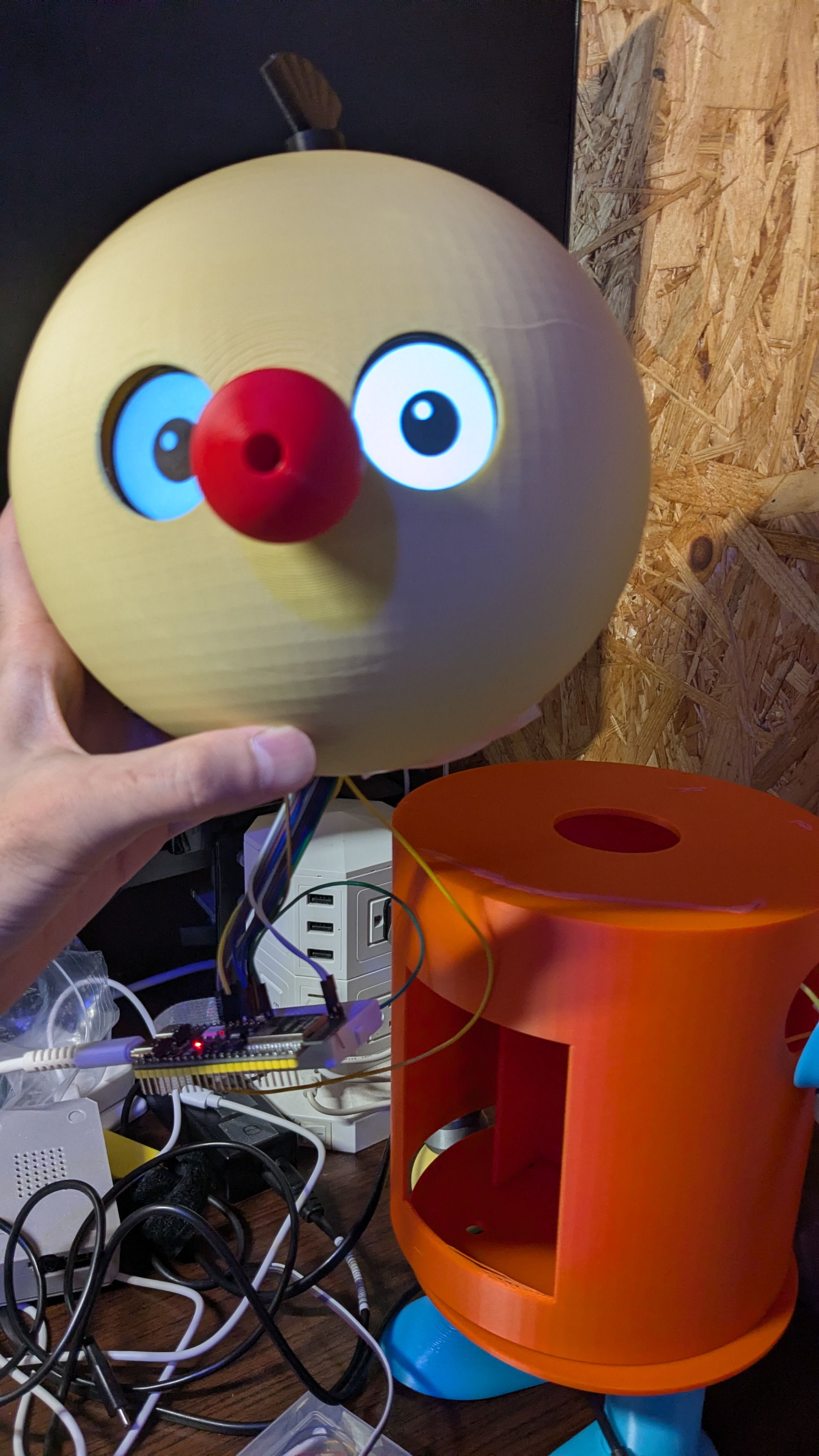 Korosuke's head — 2× GC9A01 round eyes + red camera-nose, driven by the ESP32-S3 co-MCU