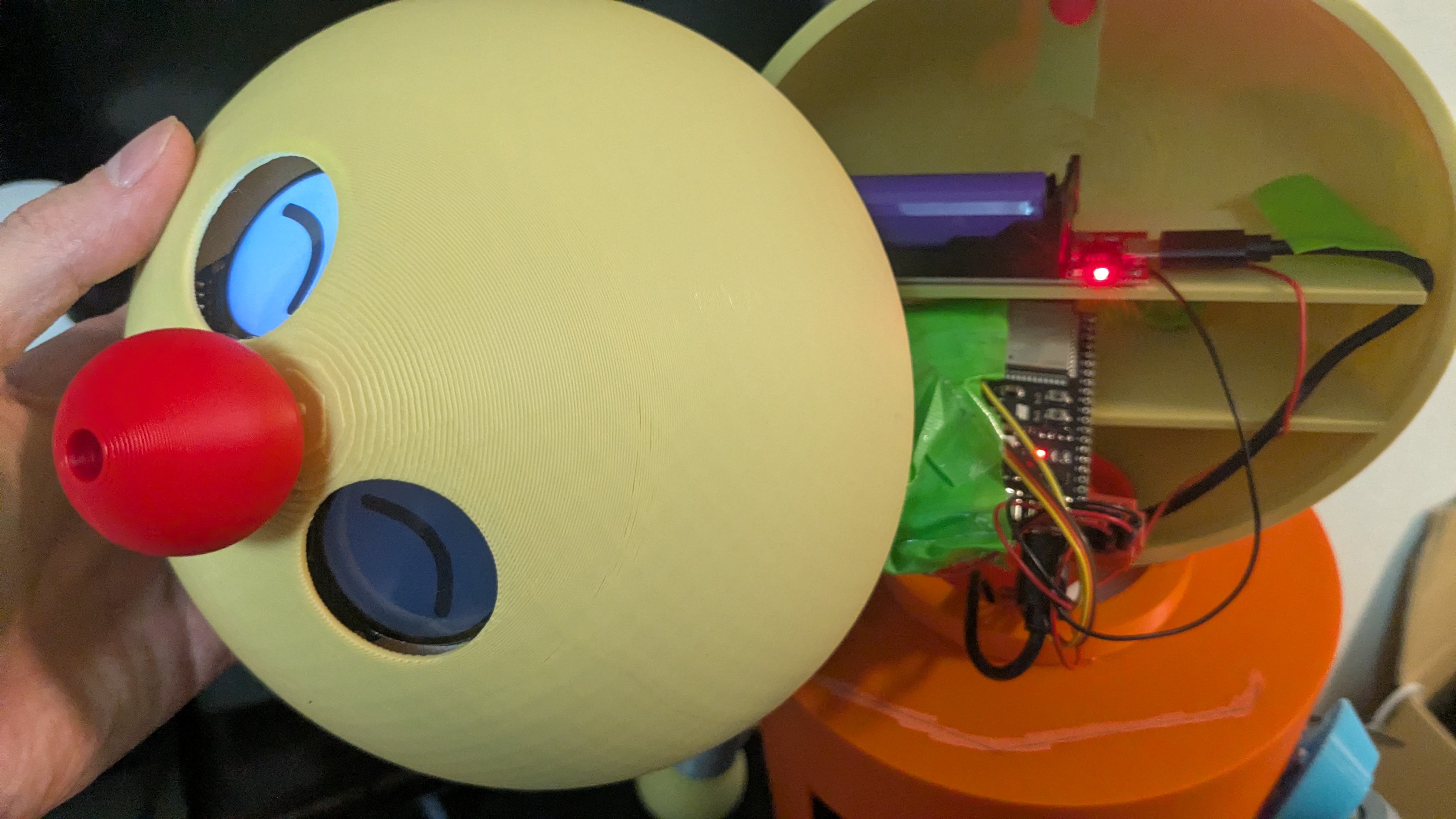 Inside the head — eye displays behind the face, ESP32-S3 co-MCU on its tray