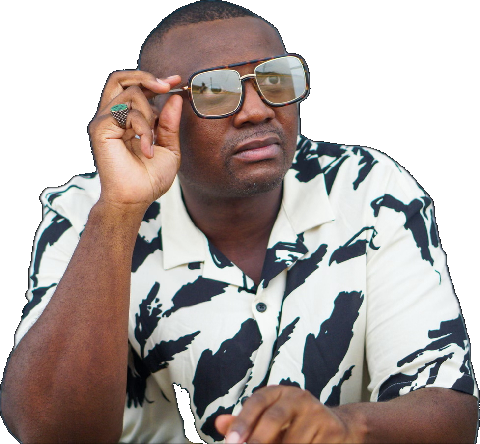 Steve Ryan wearing sunglasses and a patterned shirt