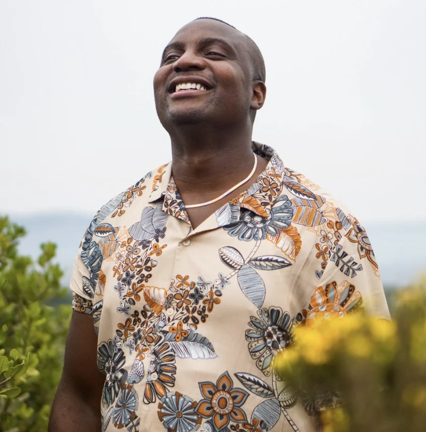 Steve Ryan smiling in a patterned shirt
