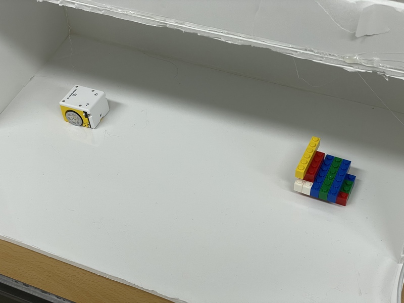 A picture of a Hamster bot moving toward an obstacle down a sewer where a water level sensor has detected an issue.