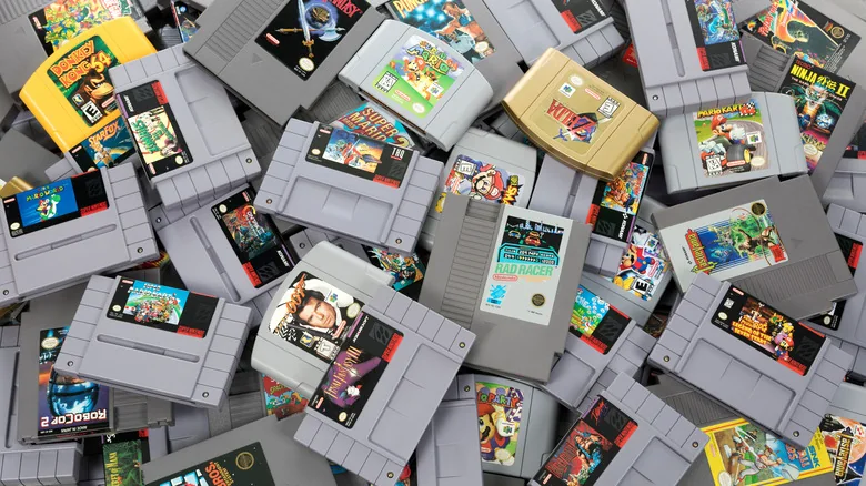 An assorted pile of retro game cartridges.