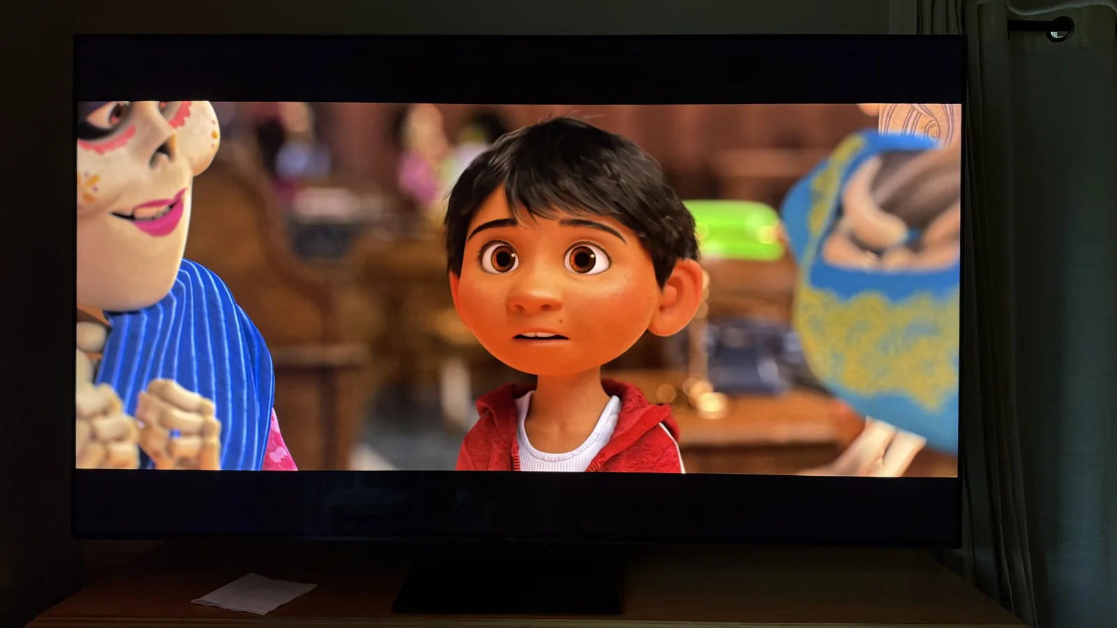 The TCL QM7L showcasing its color coverage with a scene from Coco