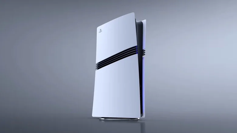 A white PS5 Pro lights up against a dark grey background