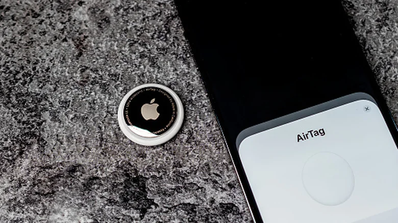 Pairing an AirTag with an iPhone over NFC.