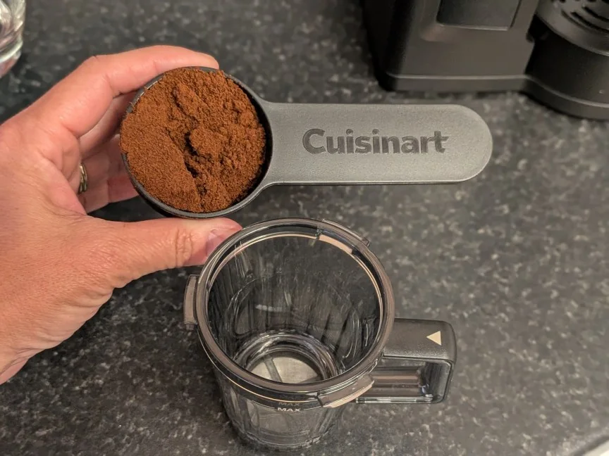 An inlucded scoop fits the mouth of the filter cup.