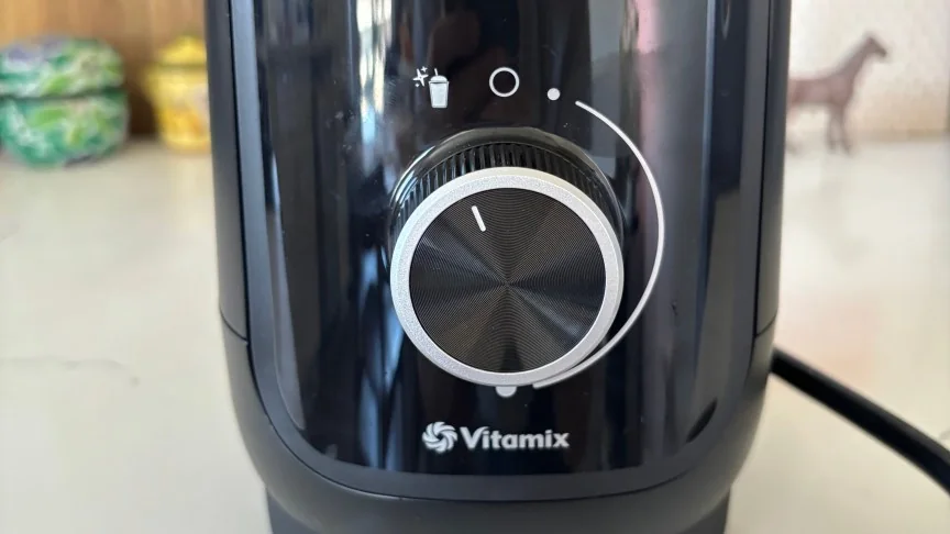 A close-up of the control dial on the black Vitamix Nano personal blender.