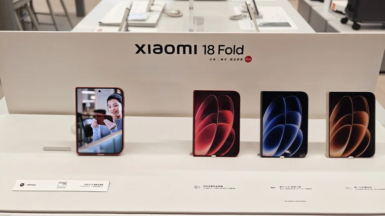 The Xiaomi 18 Fold in different colors on a store table.