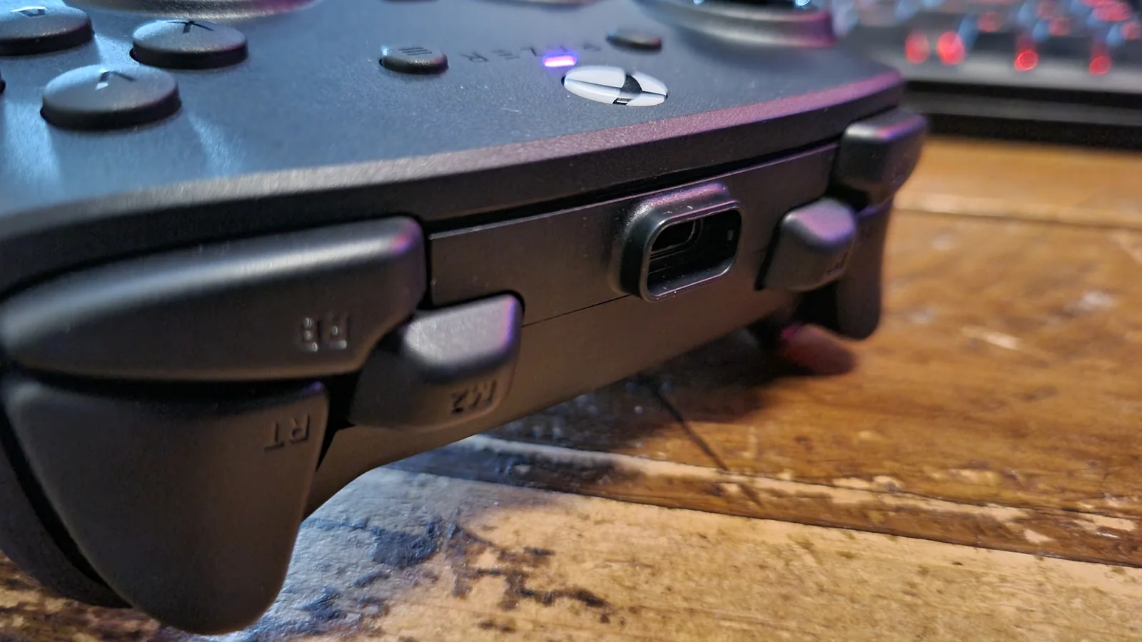 The topside controls of the Razer Wolverine V4 Pro, either side of the protruding USB Type-C port