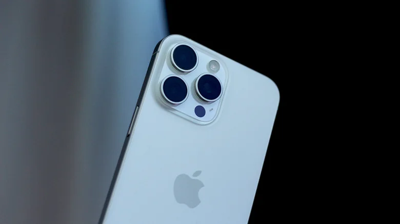 Close-up of the back of a white iPhone 15 Pro Max.