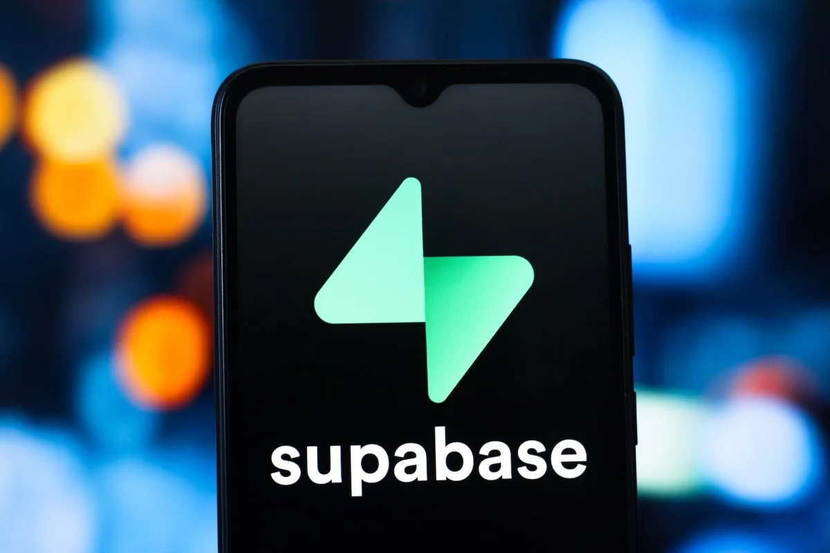 Supabase logo is seen displayed on a smartphone screen.