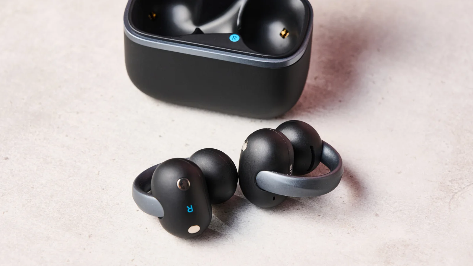Anker Soundcore AeroClip 2 beside charging case
