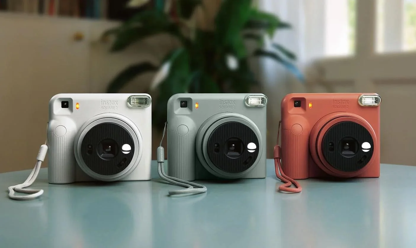 The three color options of the Fujifilm Instax Square 2 camera.