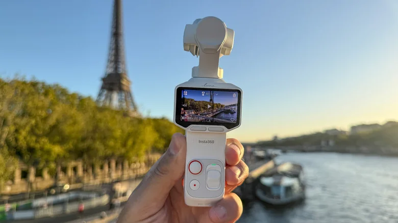 INsta360's Luna Pro gimbal camera is shown in Paris with the Eiffel Tower and Seine river in the background.
