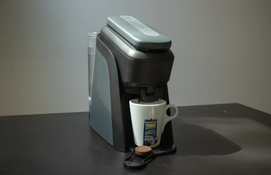 Tabli brewer with cup and tab beside it