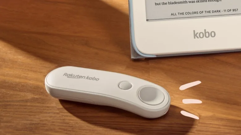 Kobo remote on a desk with an ereader in the background.