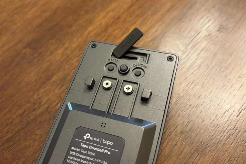 Tapo's doorbell with a close up of the microSD port, open.