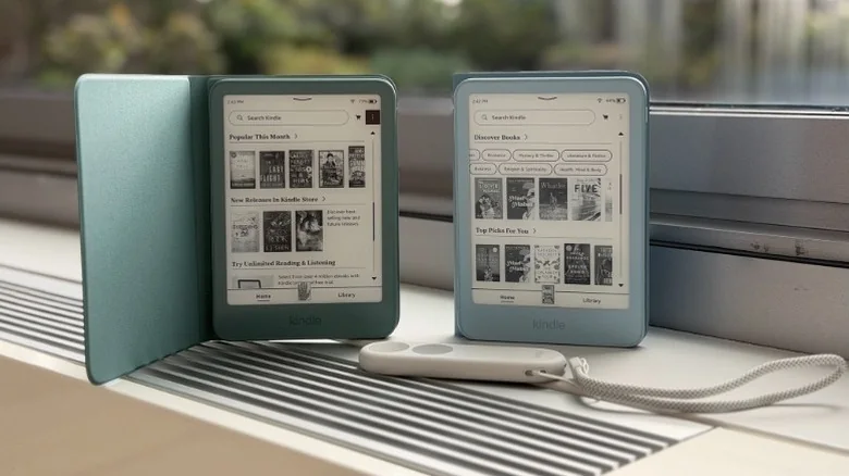 Ereaders by a window with a remote that has a wrist strap.