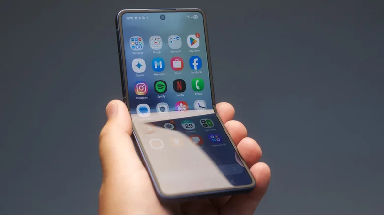 A hand holds a Samsung Galaxy Z Flip 7.