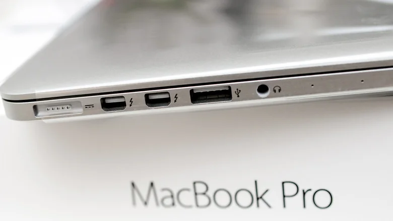 Side view of an older MacBook pro, showing Thunderbolt Mini DisplayPort ports alongside other ports.