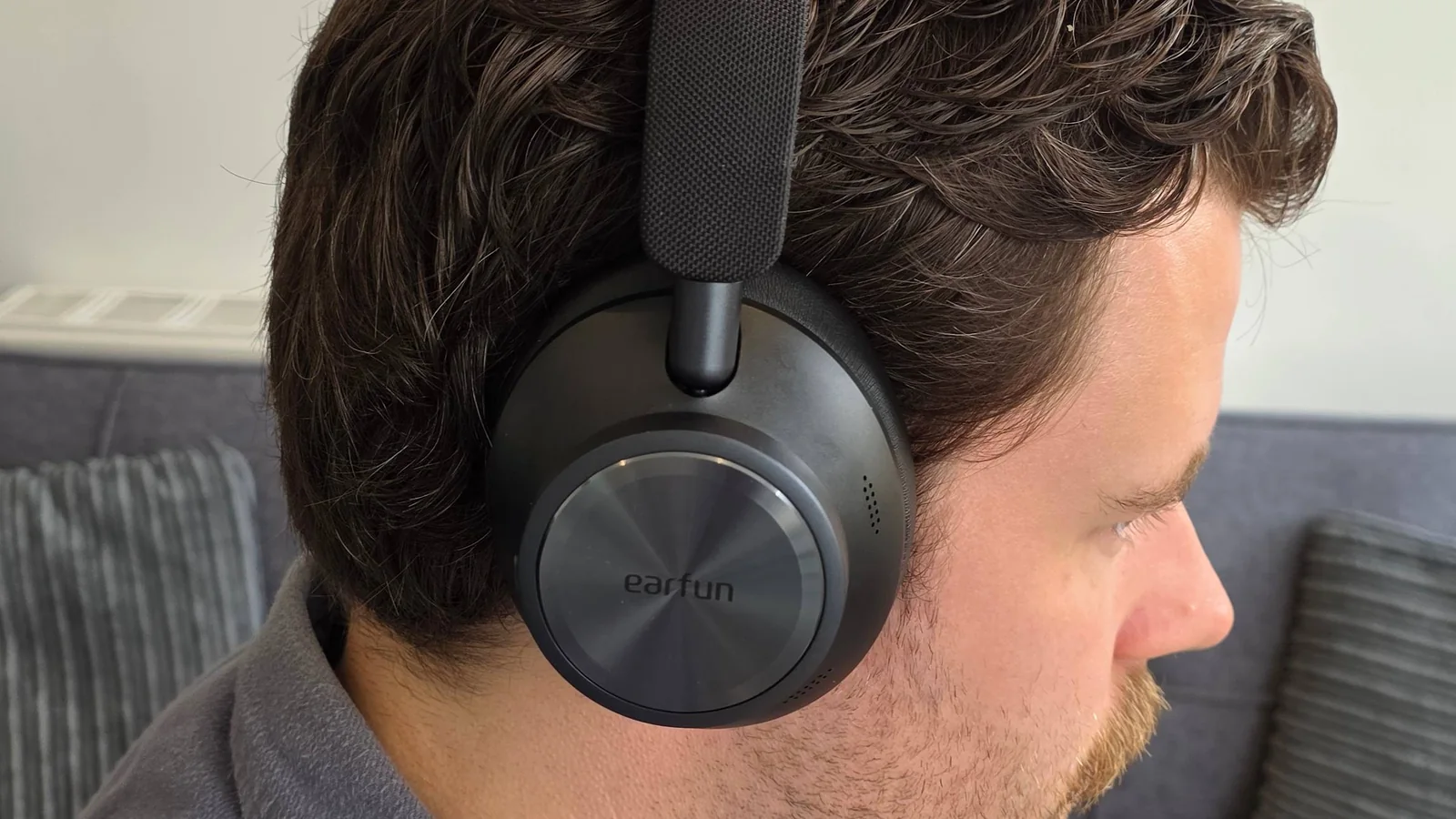 The Earfun Wave Pro X on a man's head.