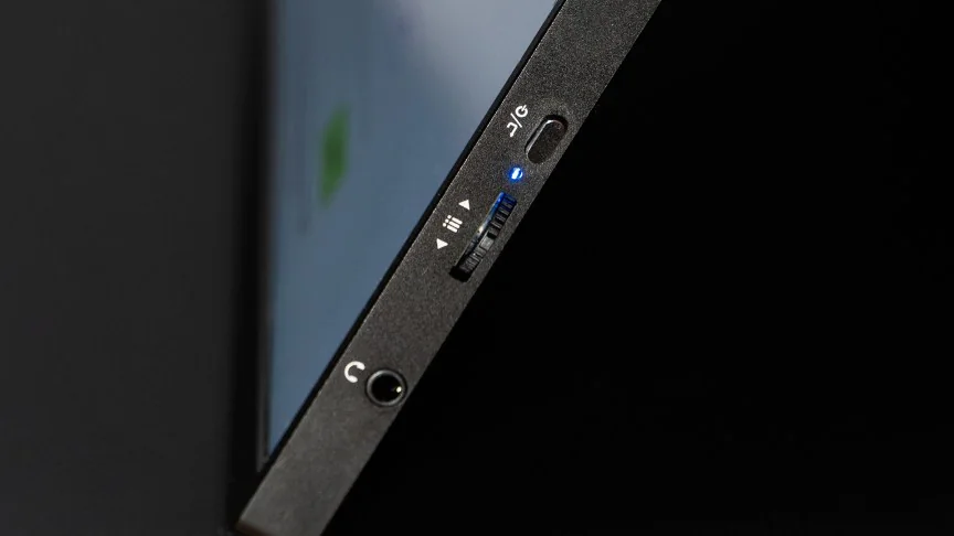 A closeup of the Uperfect BE16CU's controls and headphone jack.