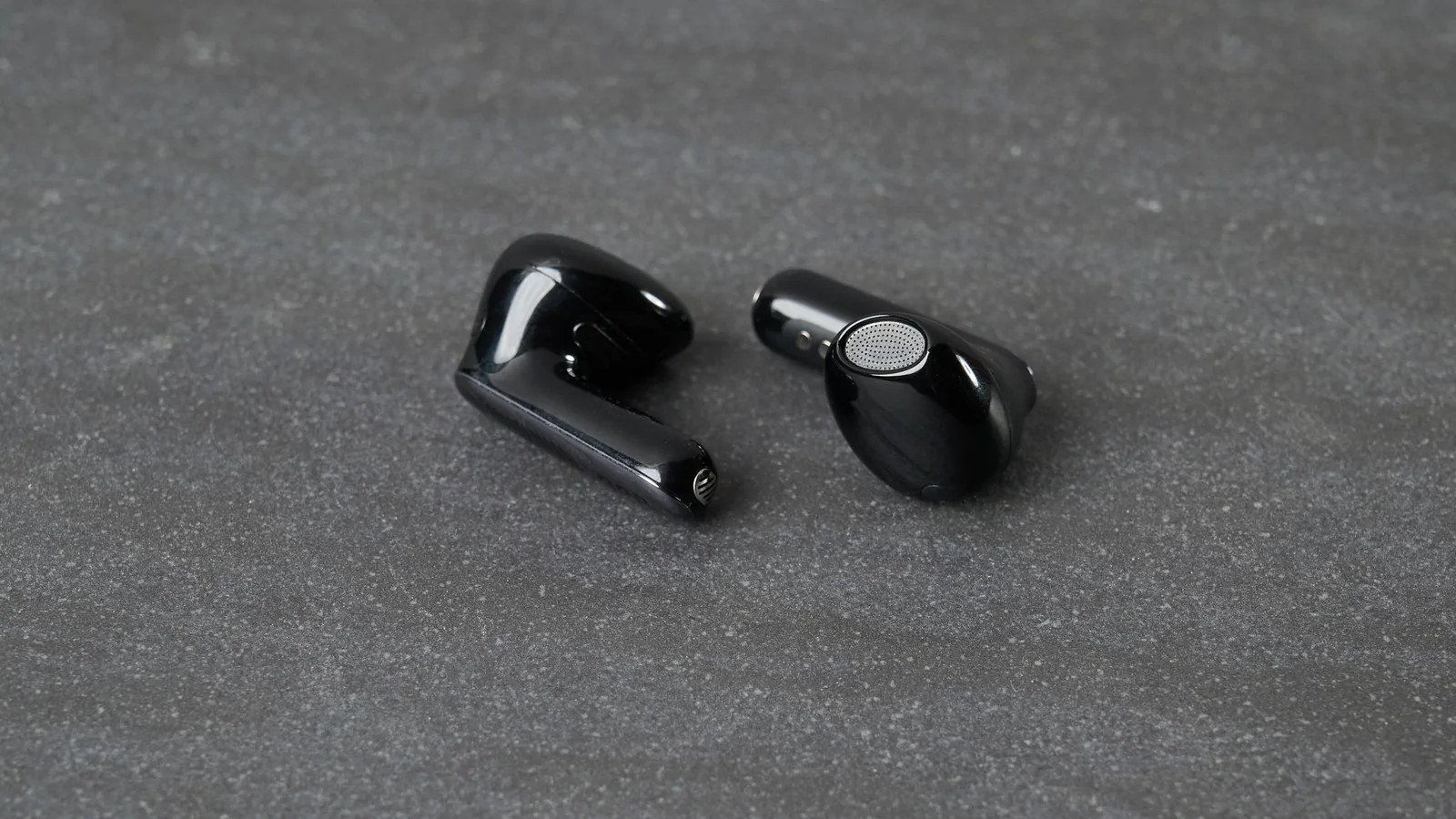 JBL Live Flex 4 earbuds on table