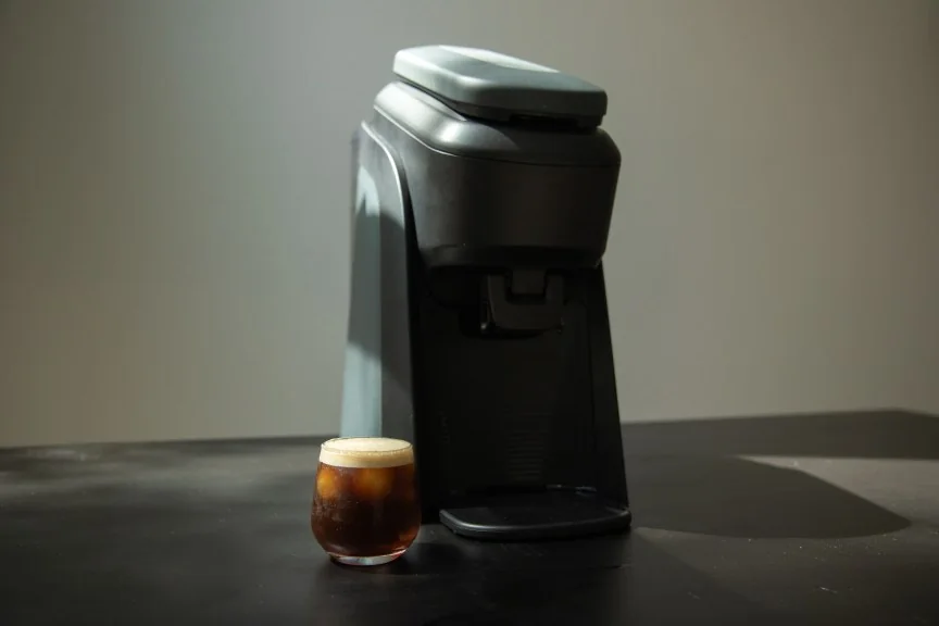 tabli brewer with iced espresso beverage beside it