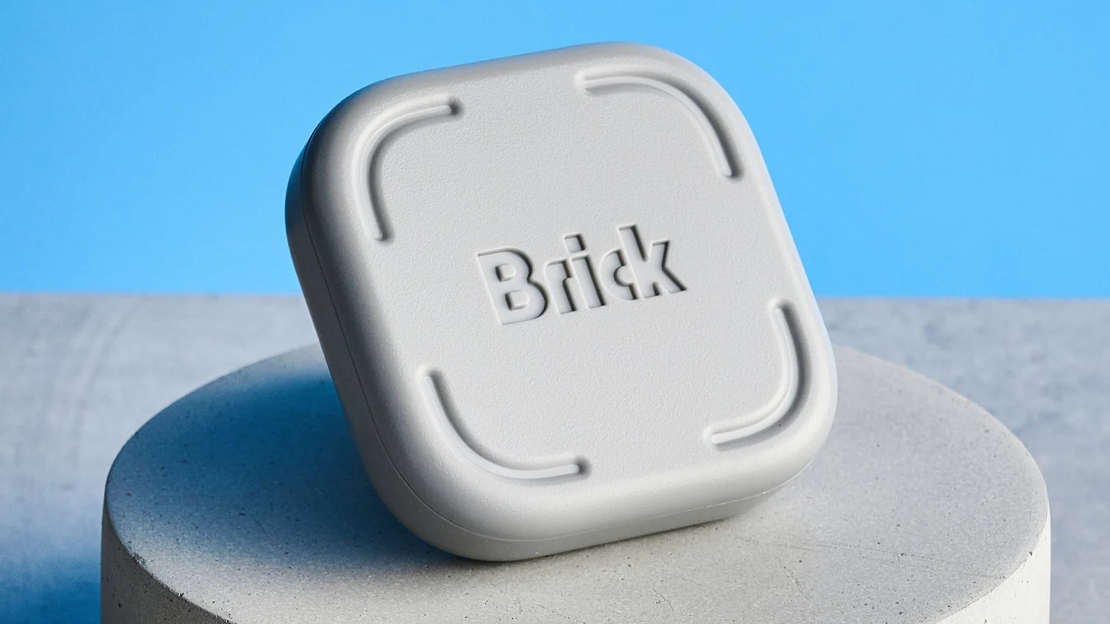 The Brick gadget photographed in front of a blue background