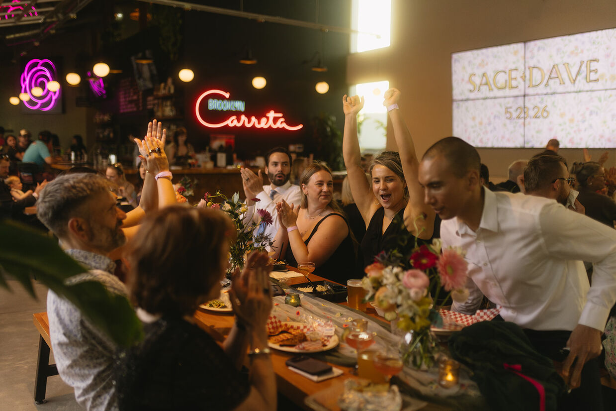 Guests celebrating at a Portland food cart pod wedding reception at Brooklyn Carreta