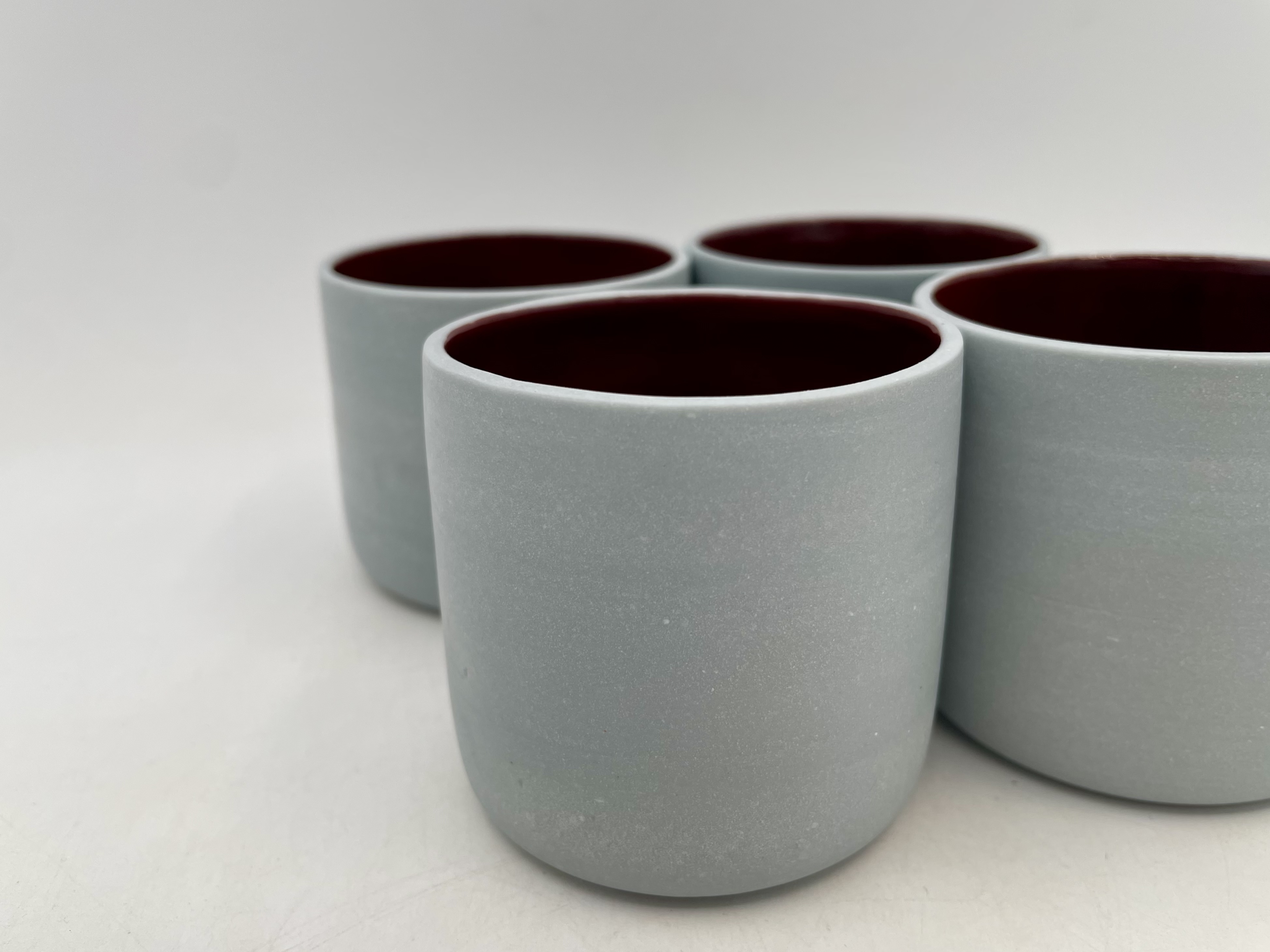 set of 4 identical porcelain tea cups
