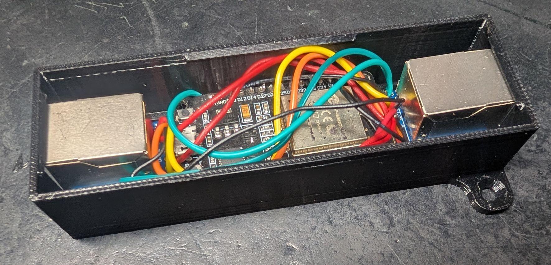 ESP32 and both RJ45 breakouts mounted in the case