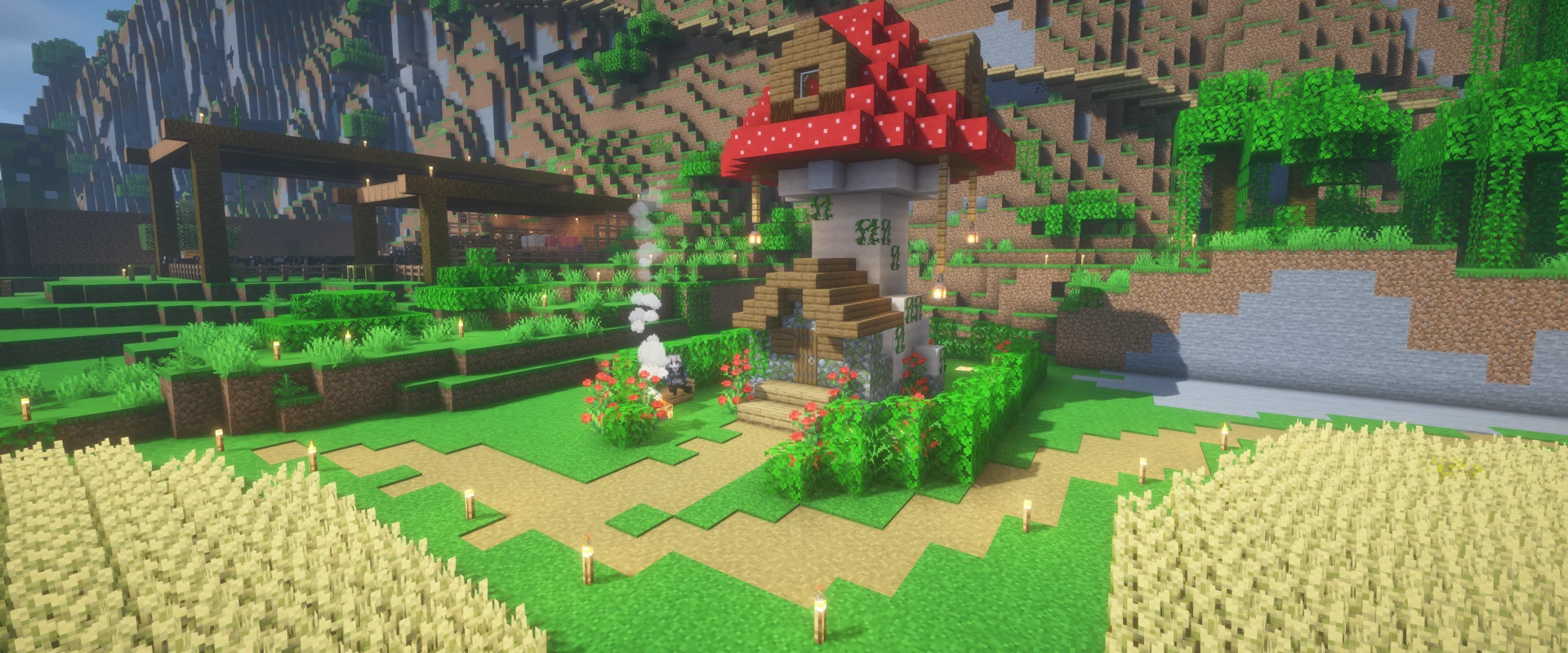 A mushroom house in a valley with wheat fields, roses, and a campfire.