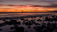 sunset_bridge_sea_rocks_clouds_4k_hd-3840x2160.jpg