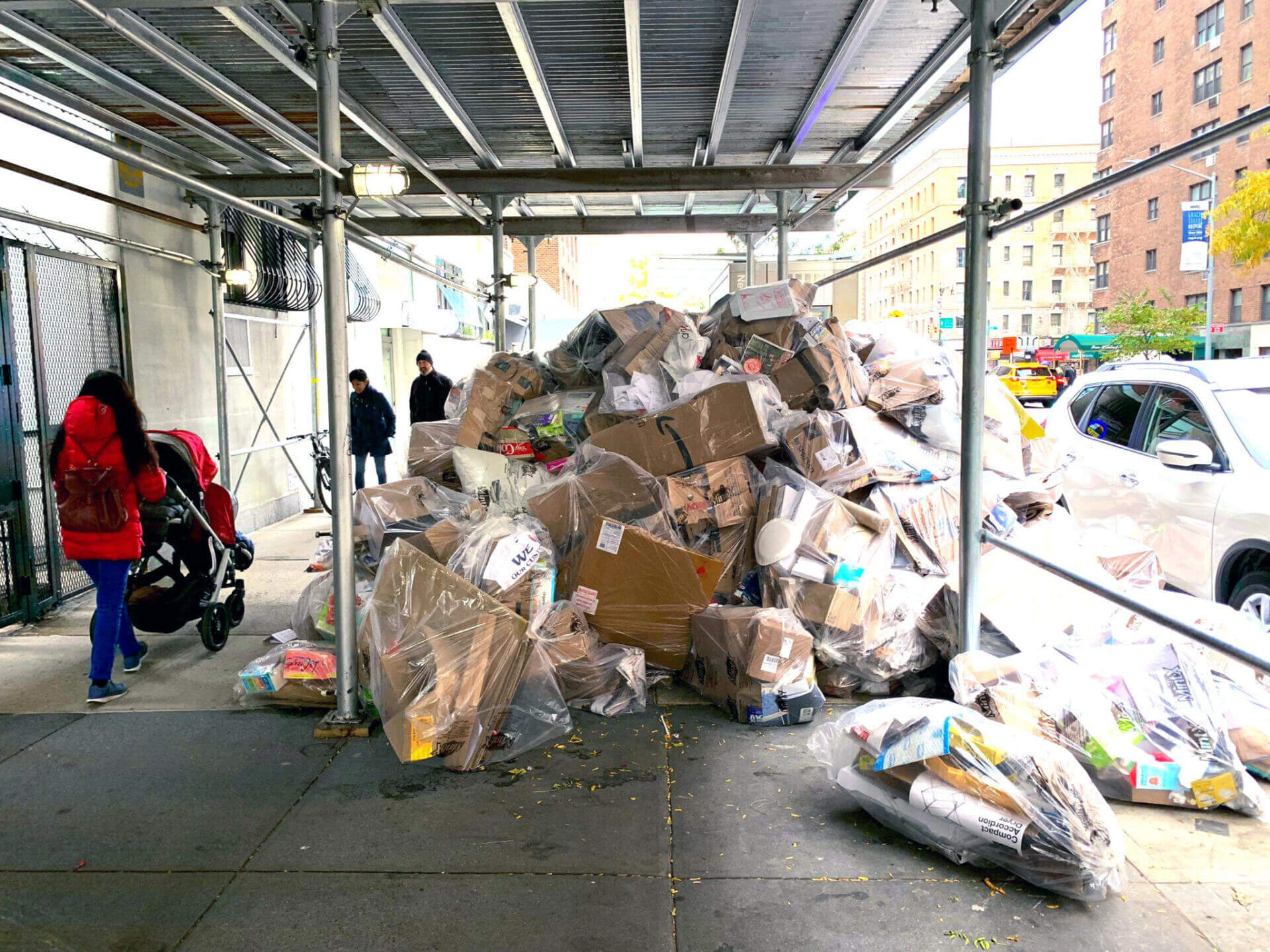 Piles of trash under scaffolding