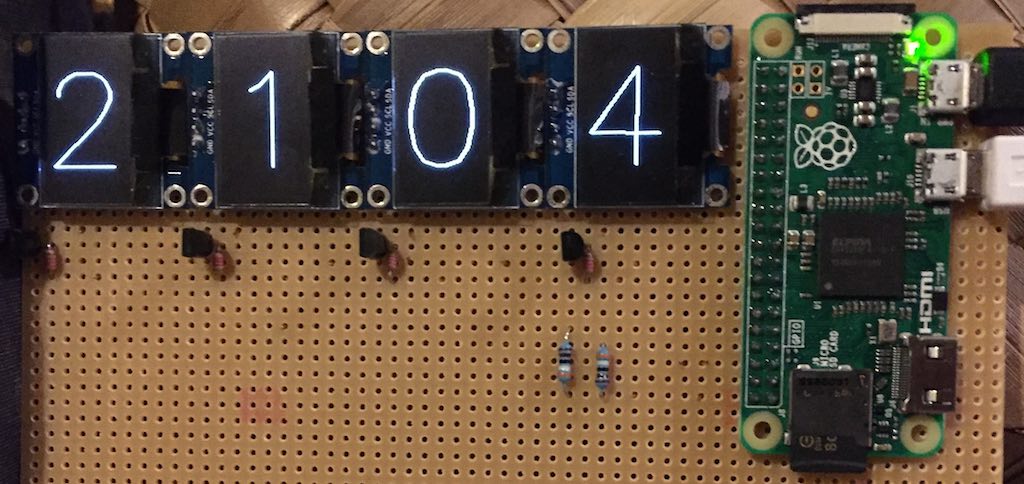 4 x OLED display clock using Hershey vector fonts