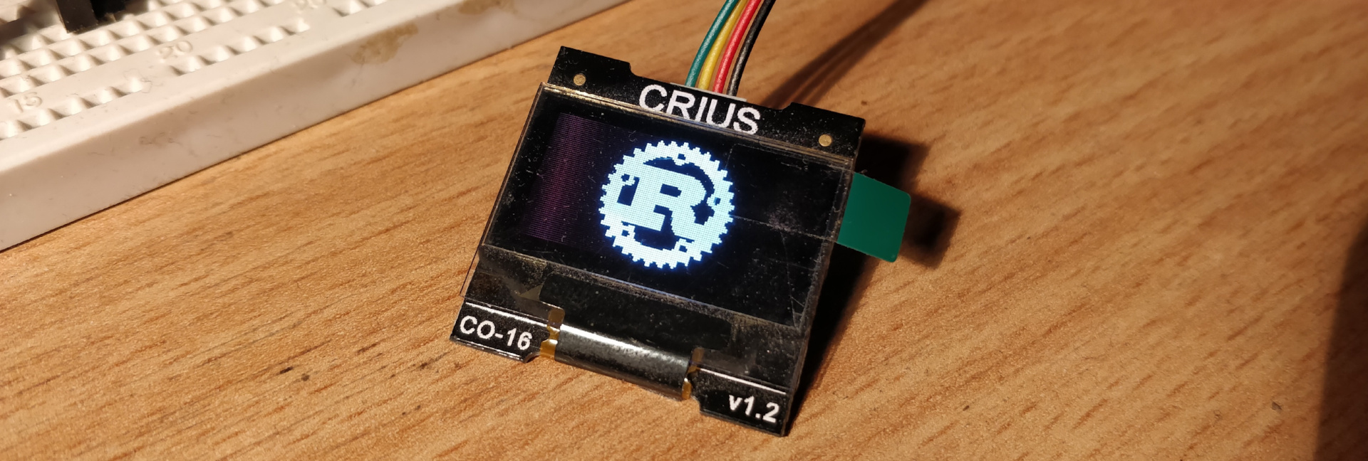 CRIUS display showing the Rust logo