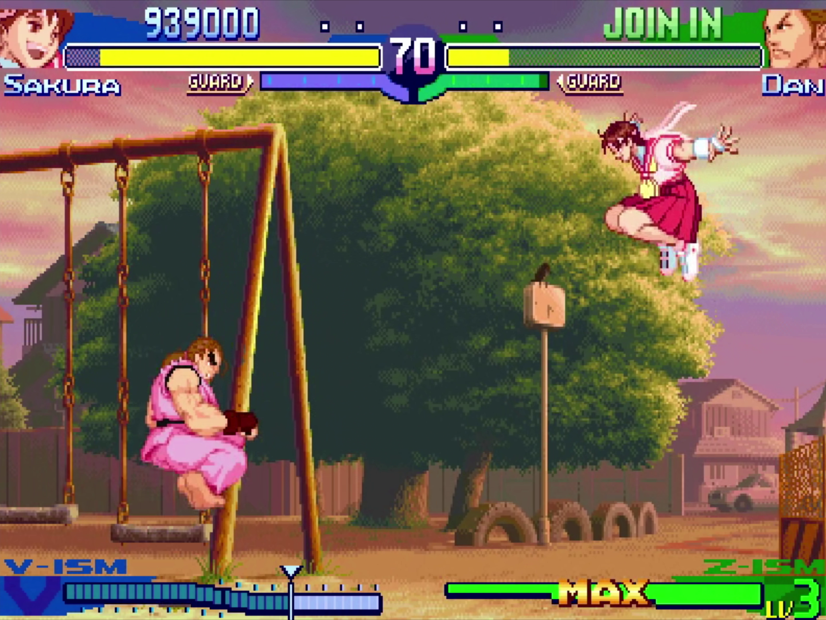 Battle screen with Sakura and Dan fighting in front of a sunset playground swing