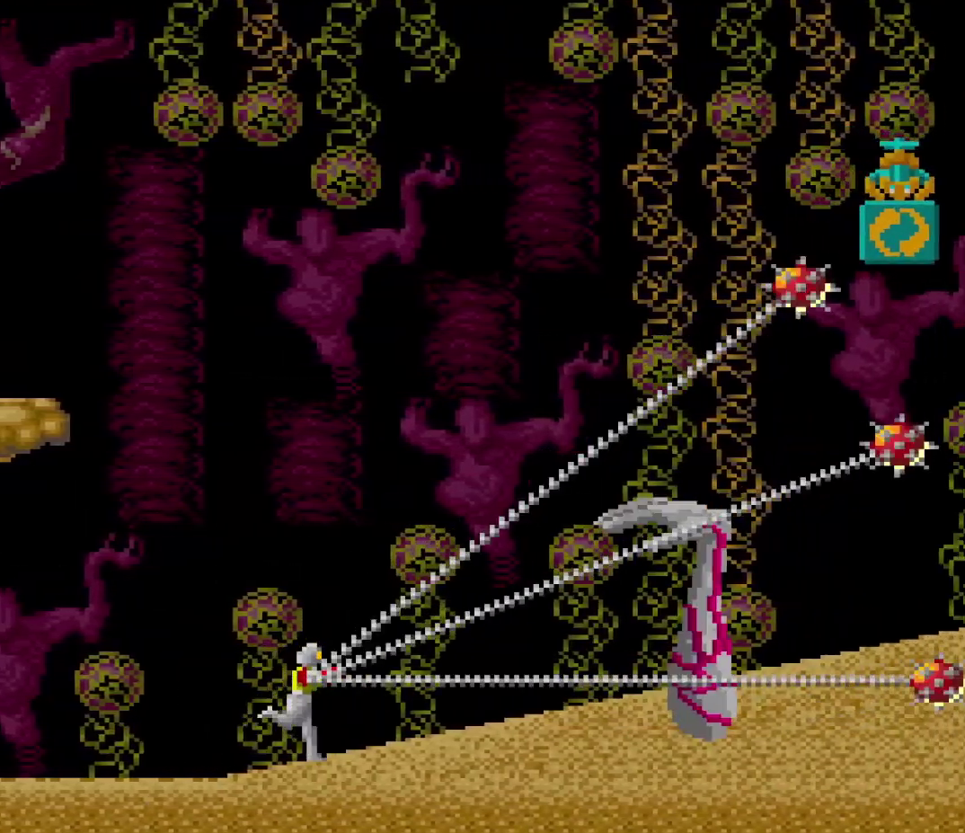 Chelnov attacking a gray arm with red veins using a chained spiked iron ball